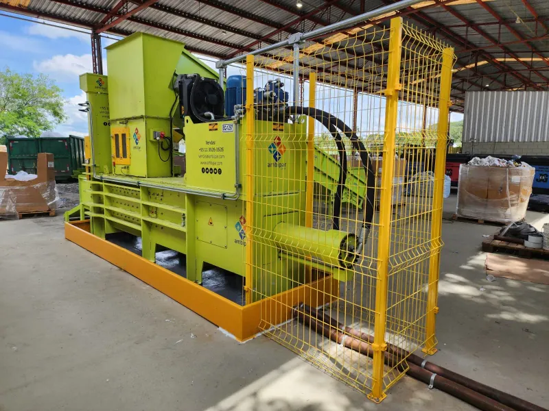 THOR press installed, with feed conveyor and safety guarding